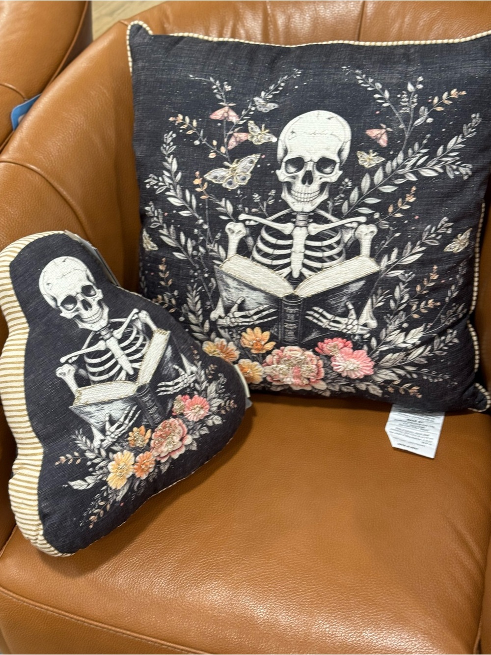 2 Skeleton Reading Floral Throw Pillows - Black